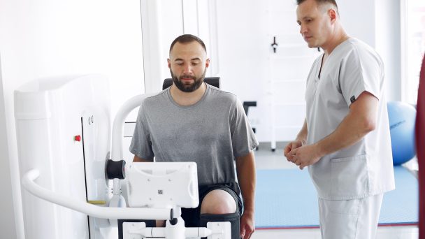 Doctor with a patient in physiotherapy clinic