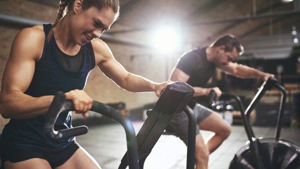 Fit people in gym while hard training