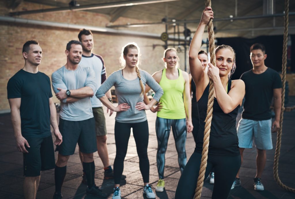 Woman holding climbing rope in cross-fit exercises